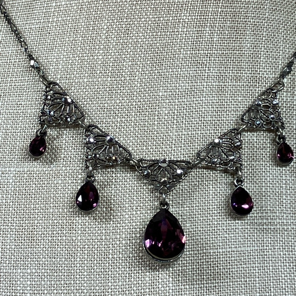 Ornate Silver Necklace with Purple Accents